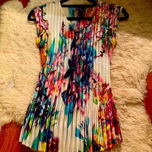 Beautiful floral Milano blouse with accordion flare